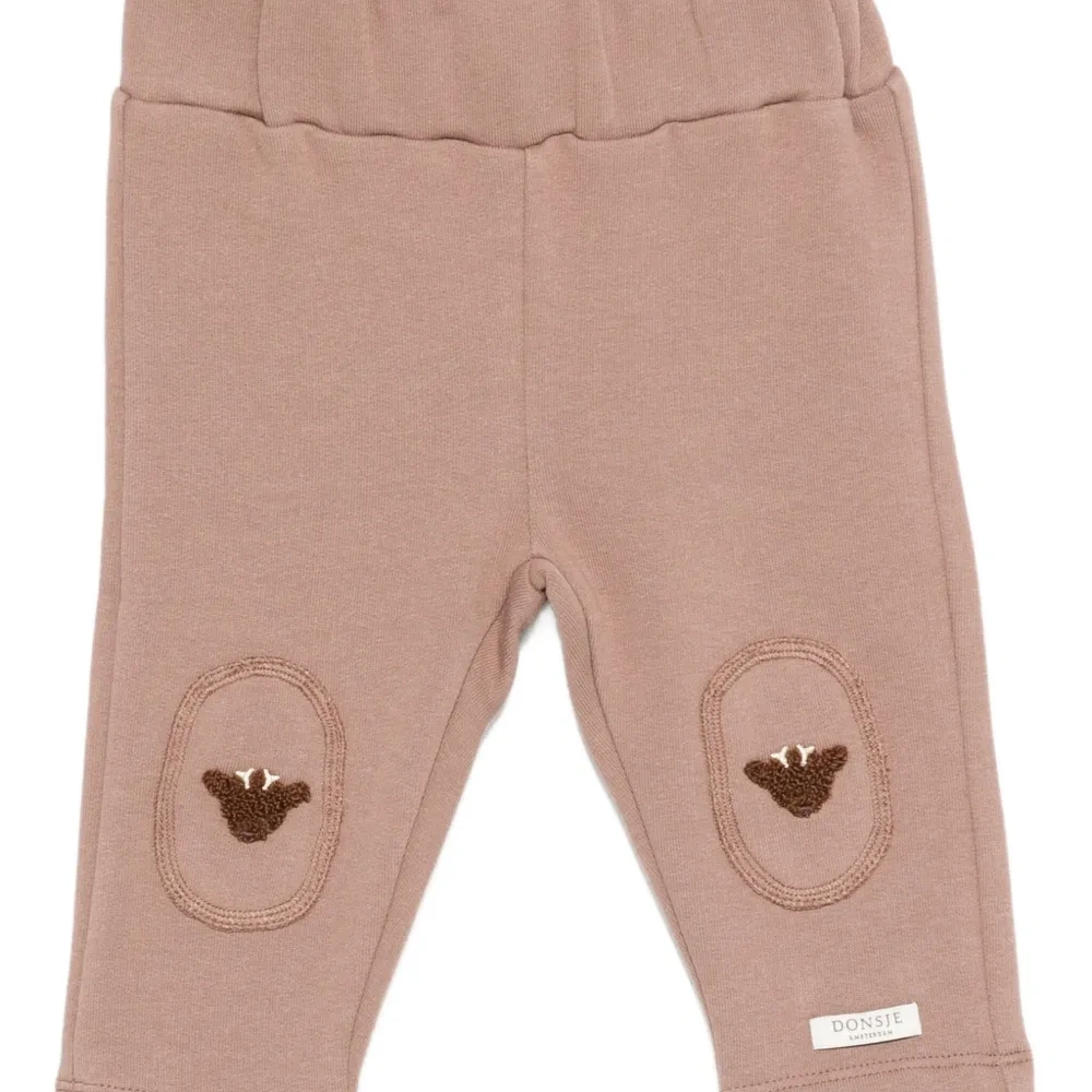 Брюки с вышивкой на коленях