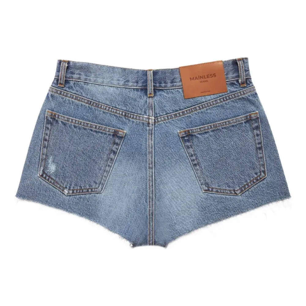 Джинсовые шорты с бахромой