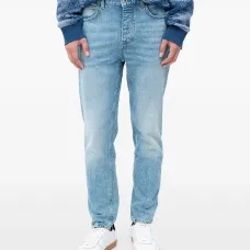 Джинсы с эффектом потертостей