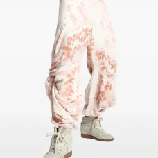 Брюки со змеиным принтом и драпировкой Брюки со змеиным принтом и драпировкой