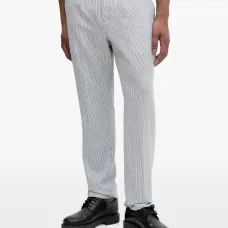 Брюки со складками и полосатым узором