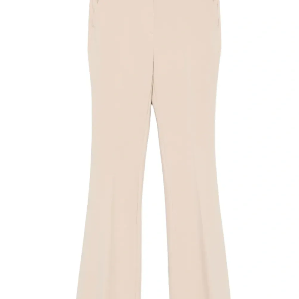 Брюки с разрезами на пуговицах