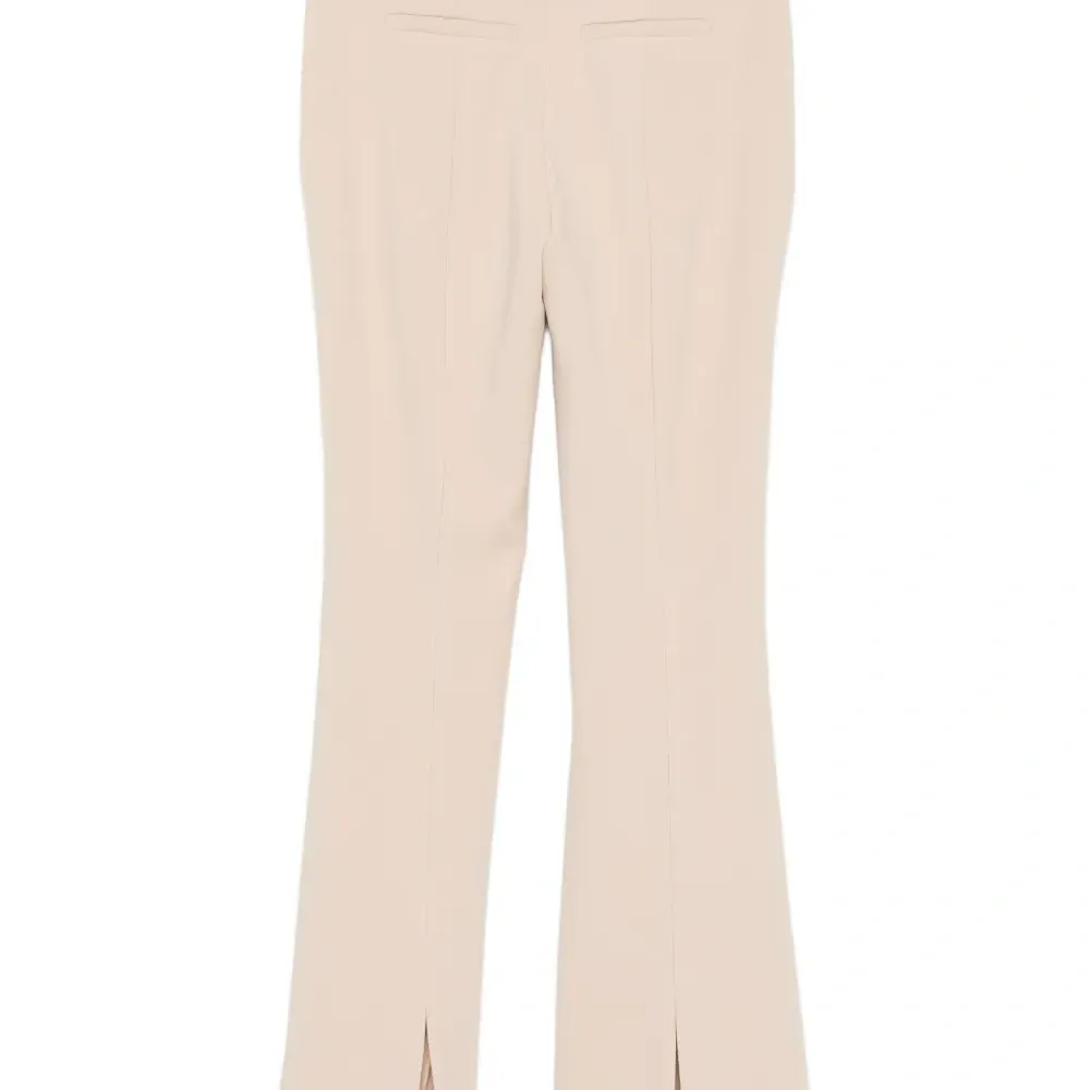 Брюки с разрезами на пуговицах