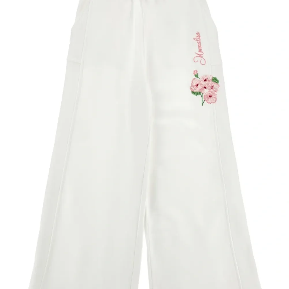 Брюки с цветочной вышивкой
