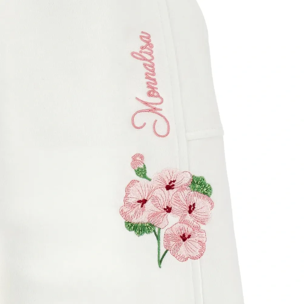 Брюки с цветочной вышивкой