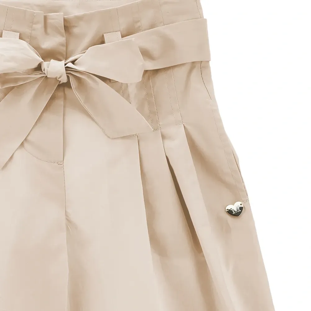 Брюки с бантом и складками