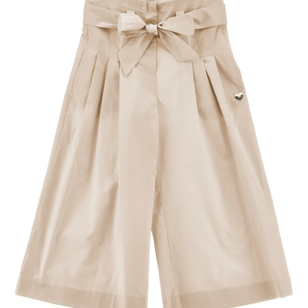 Брюки с бантом и складками