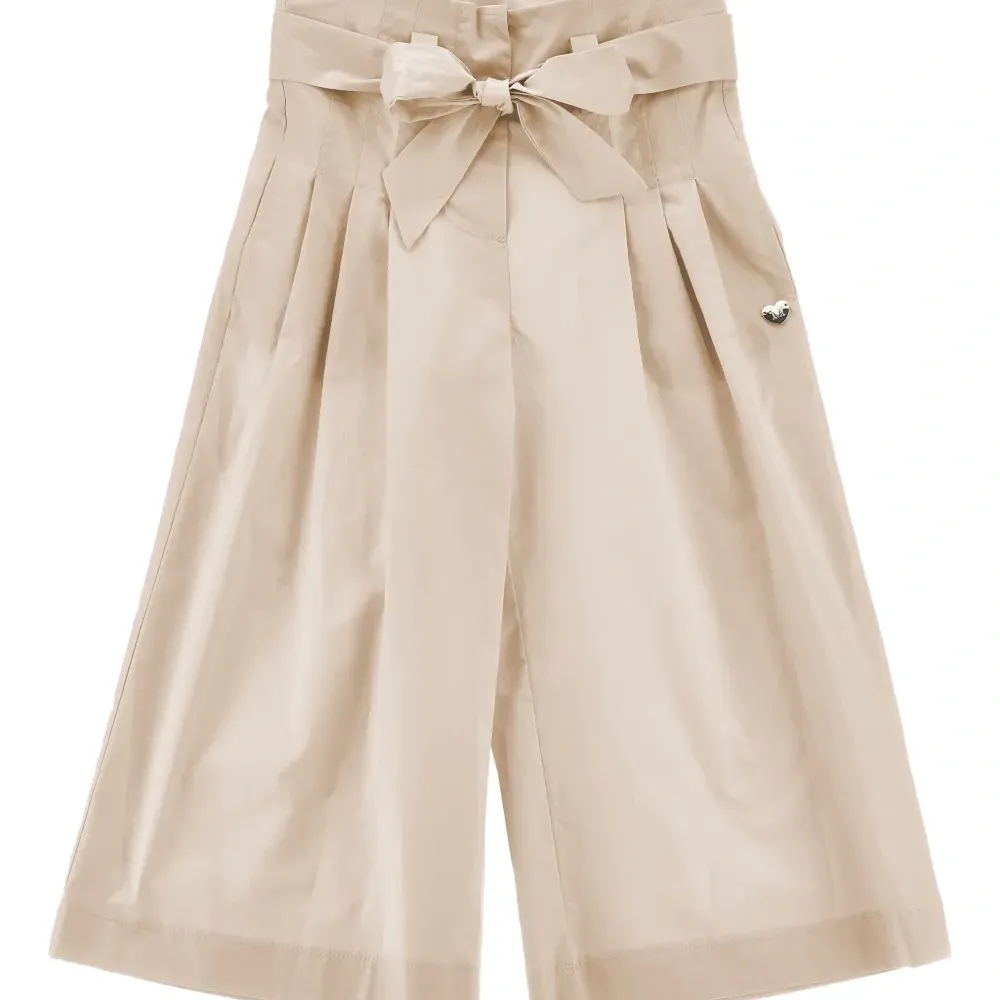 Брюки с бантом и складками