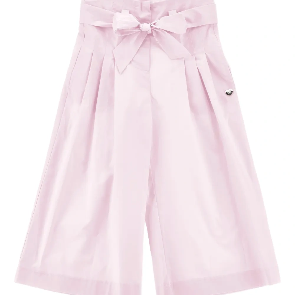 Брюки с бантом и складками