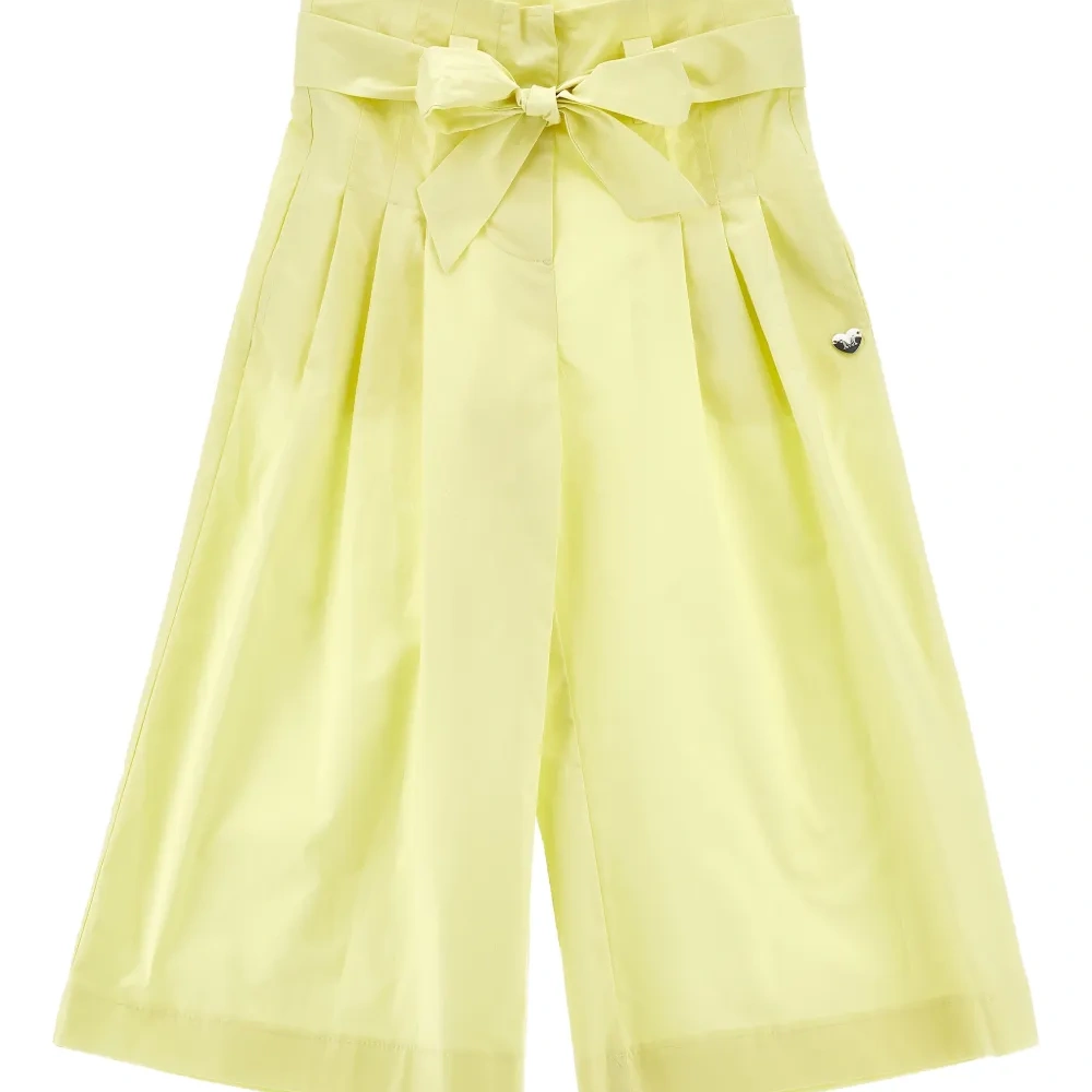 Брюки с бантом и складками