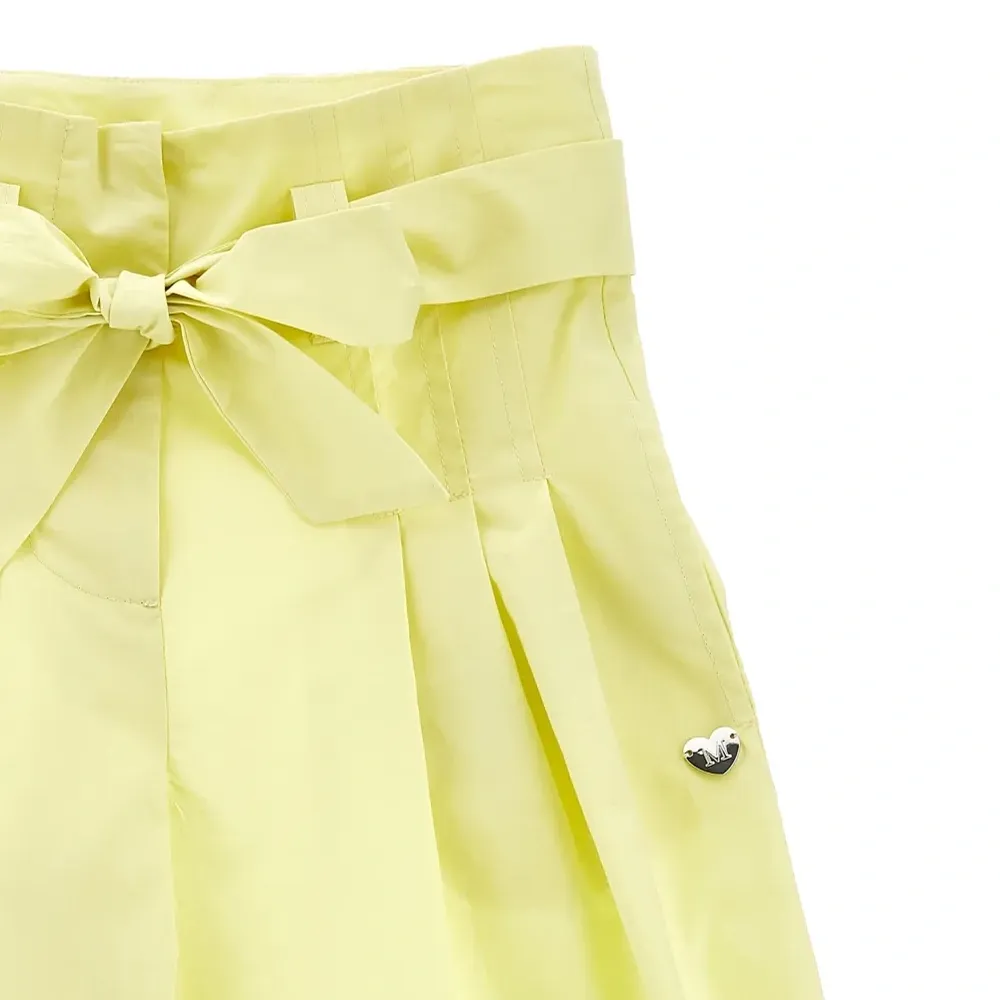 Брюки с бантом и складками