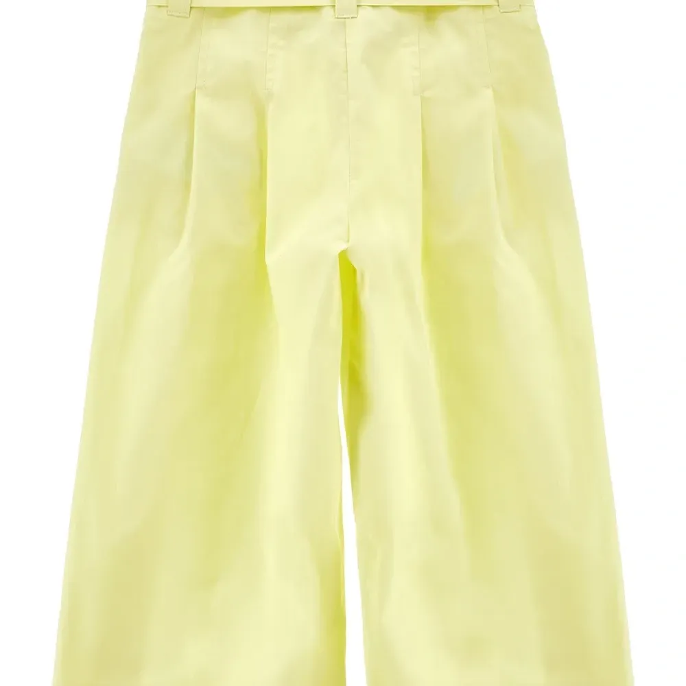 Брюки с бантом и складками