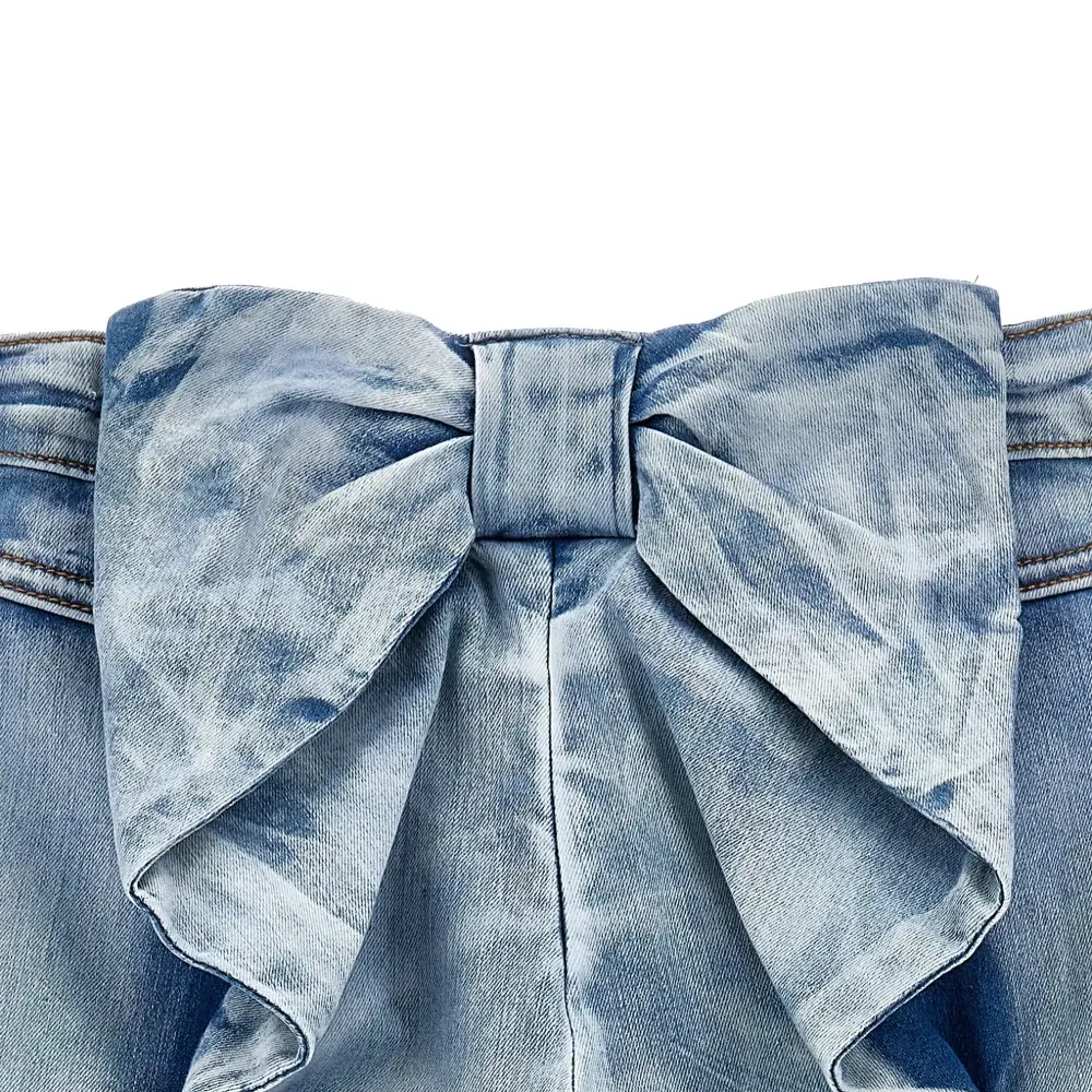 Джинсы с бантами