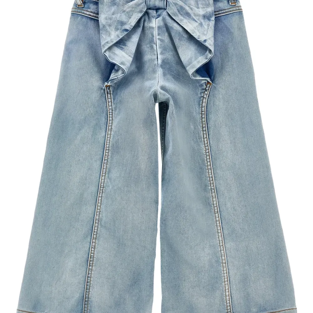 Джинсы с бантами