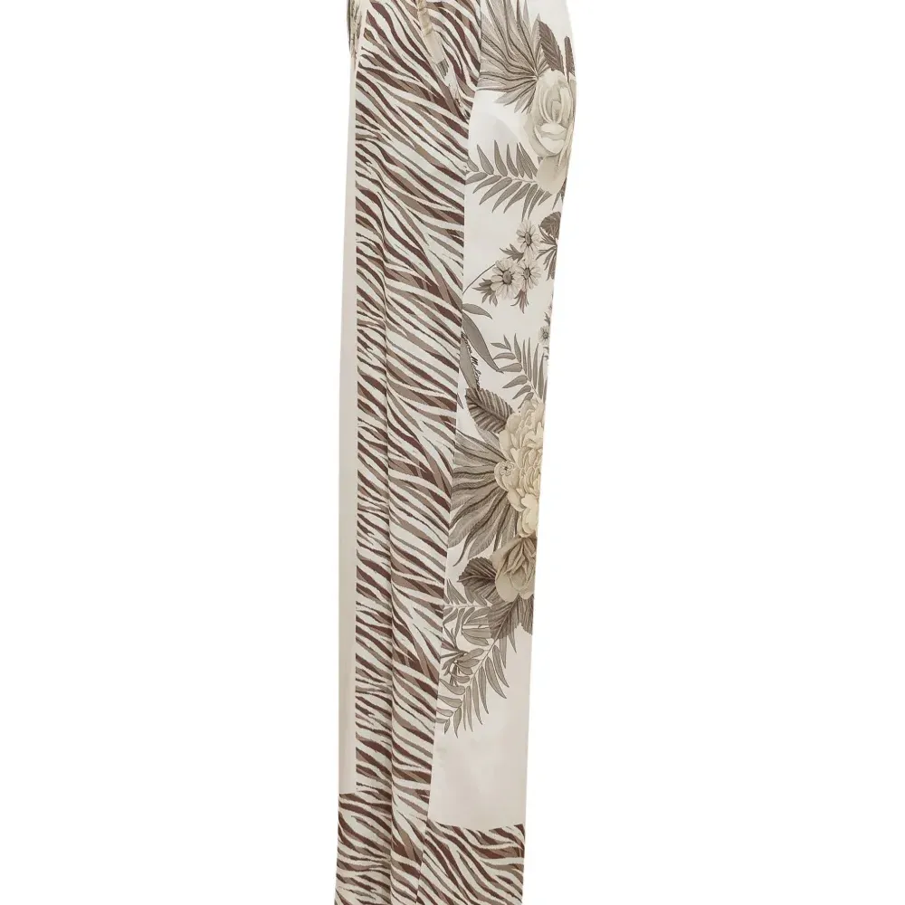 Брюки с зебровым узором и цветочным принтом Брюки с зебровым узором и цветочным принтом