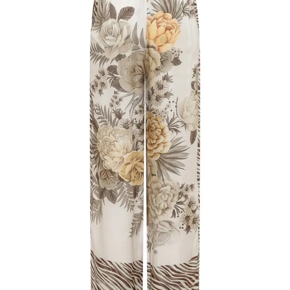 Брюки с зебровым узором и цветочным принтом Брюки с зебровым узором и цветочным принтом