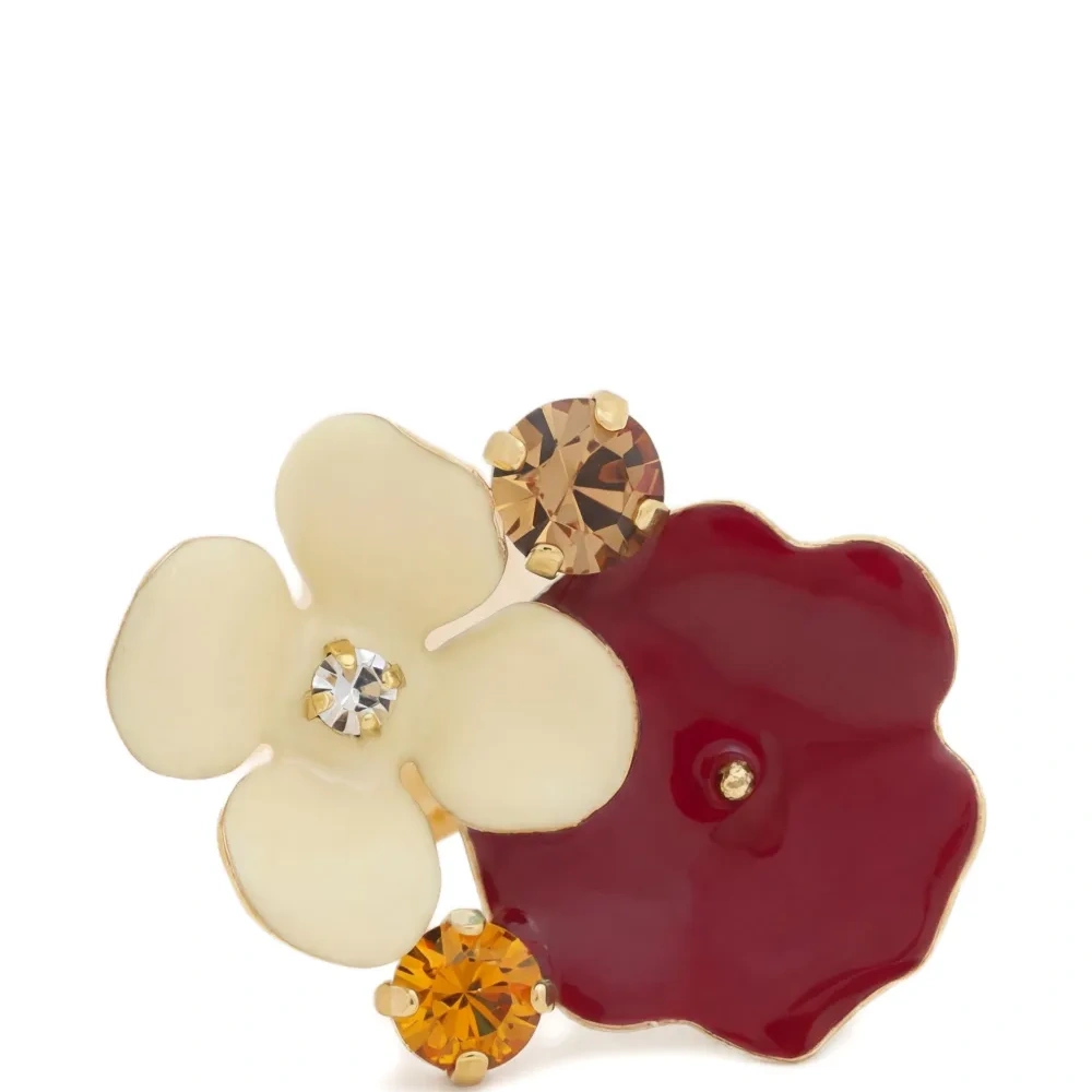 Яркое кольцо с цветком, украшенное стразами