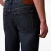 Джинсы с пятью карманами и нашивкой-логотипом