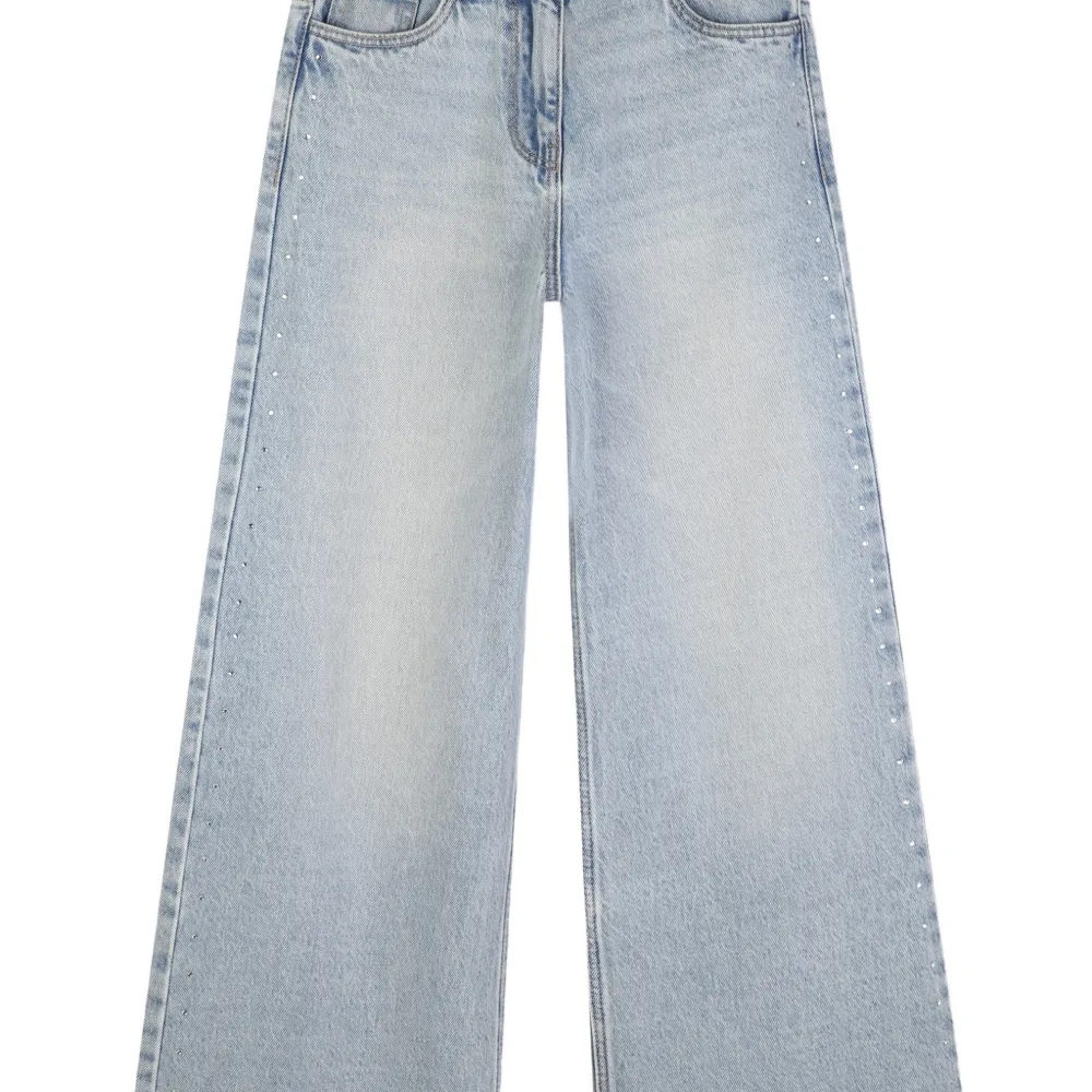 Широкие джинсы с бахромой