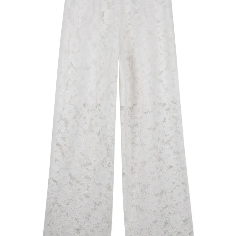 Брюки с цветочным узором Брюки с цветочным узором