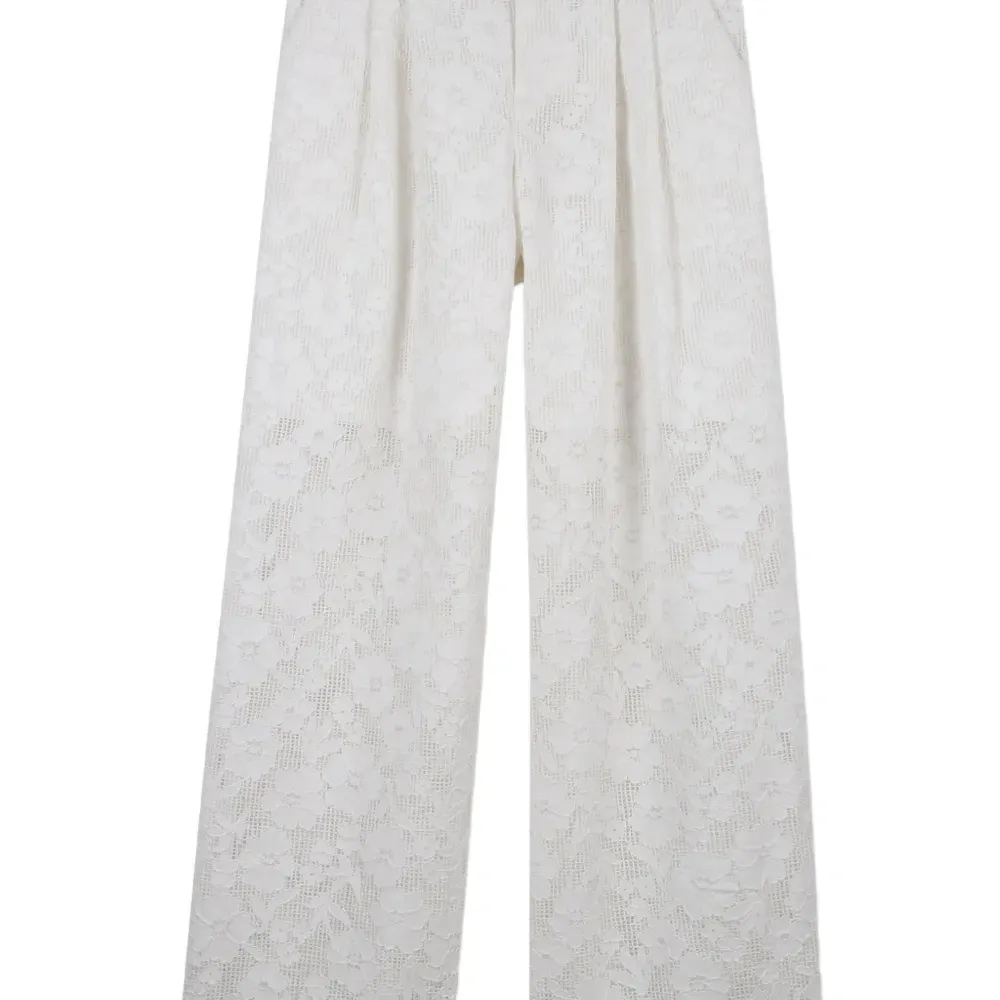 Брюки с цветочным узором Брюки с цветочным узором