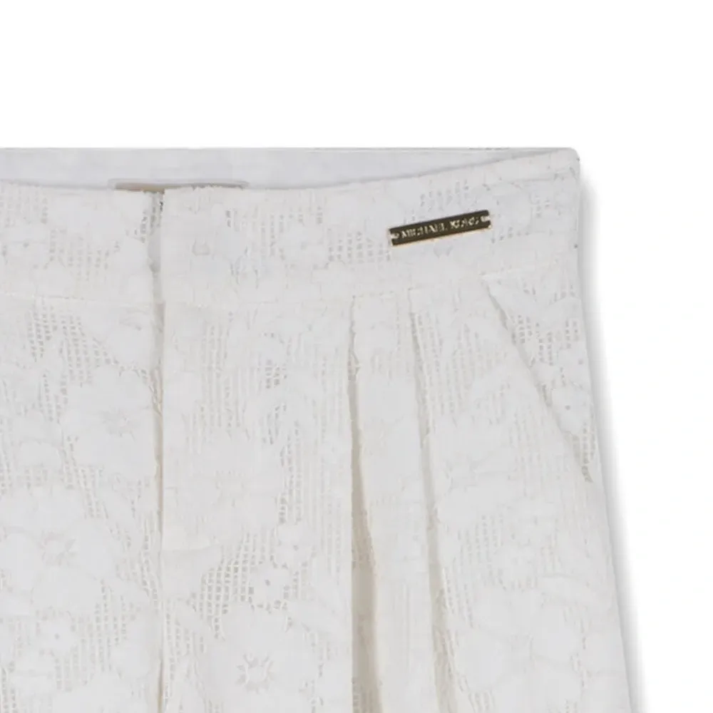 Брюки с цветочным узором Брюки с цветочным узором