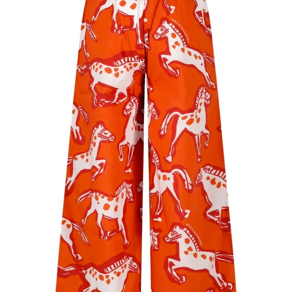 Брюки с узором в лошадей