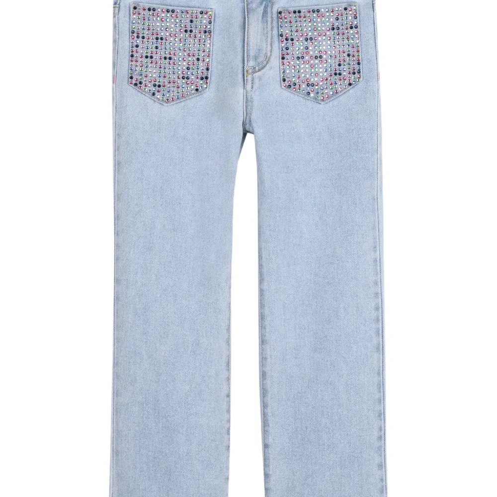 Джинсы с украшенными карманами
