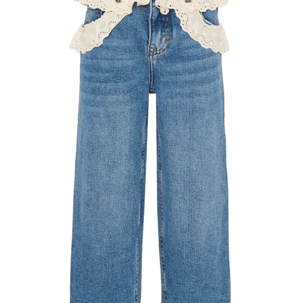 Джинсы с люверсами