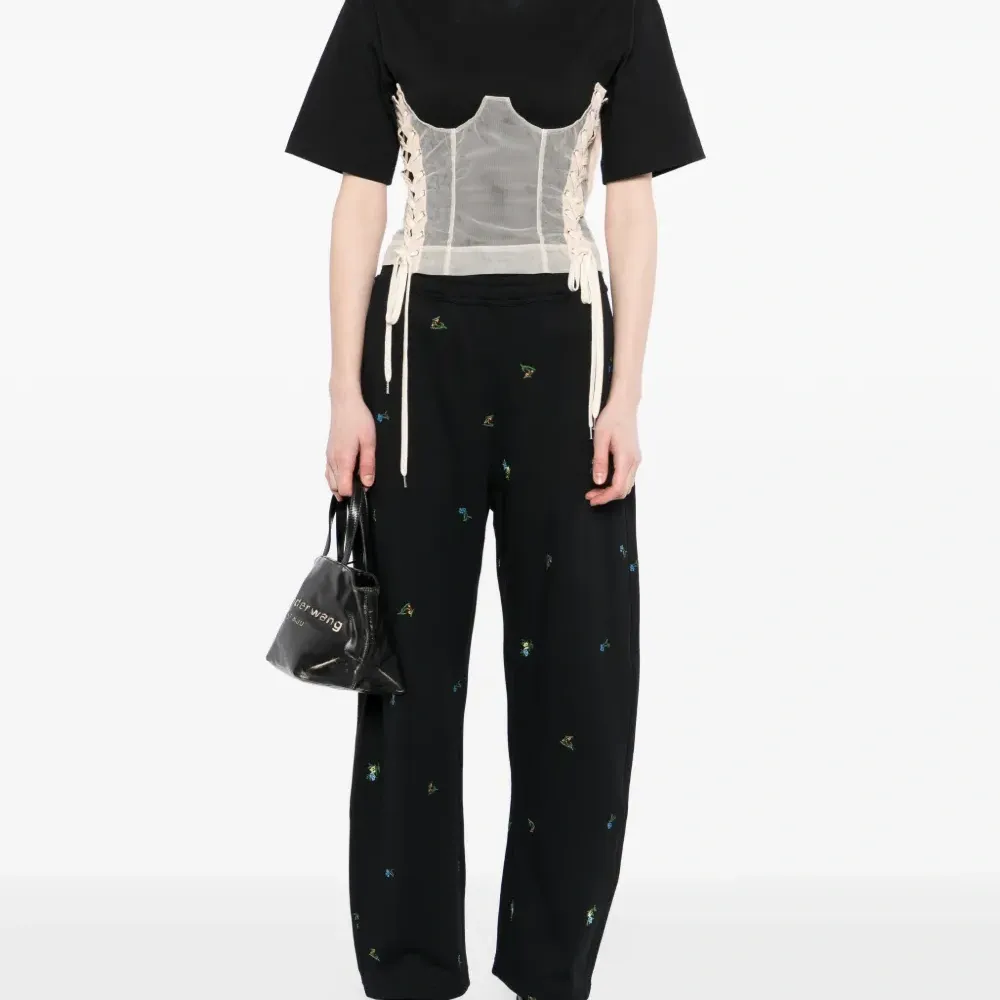 Брюки с цветочной вышивкой