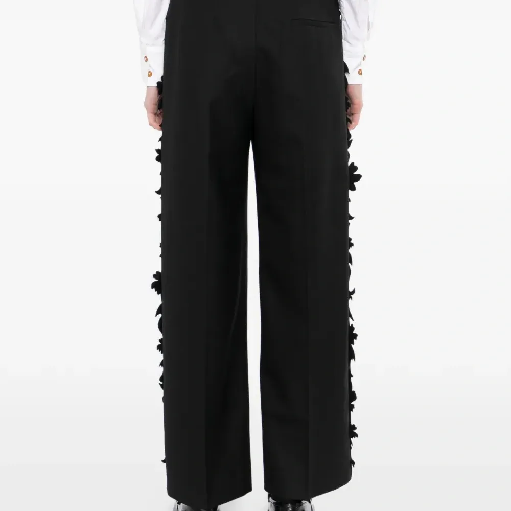 Брюки с оборками по краю