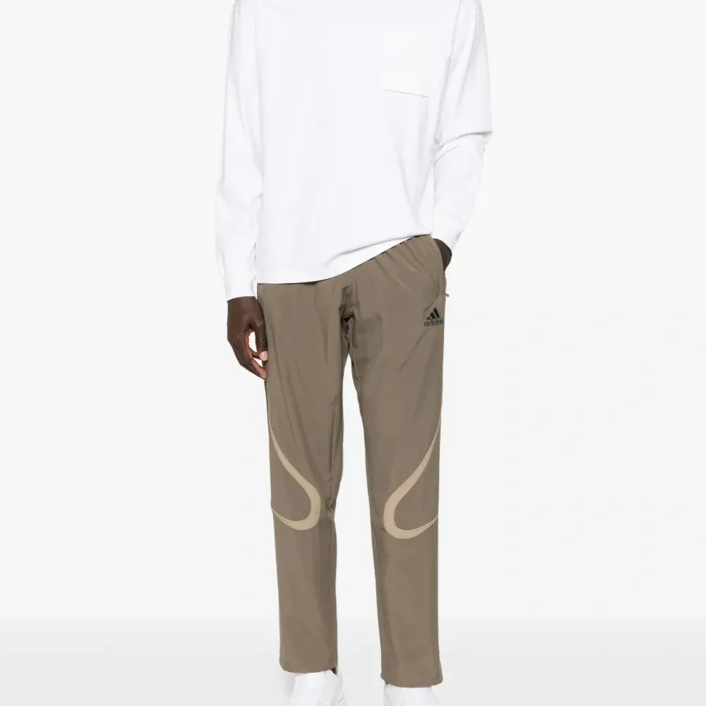 Спортивные брюки Teamgeist Adicolor с полосатыми деталями