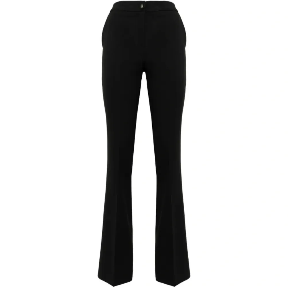 Расклешённые брюки из ткани кадди