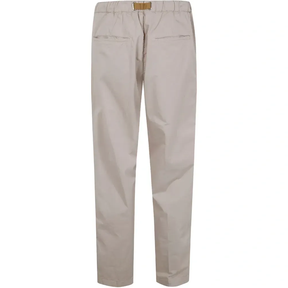 Брюки с карманами и пряжками