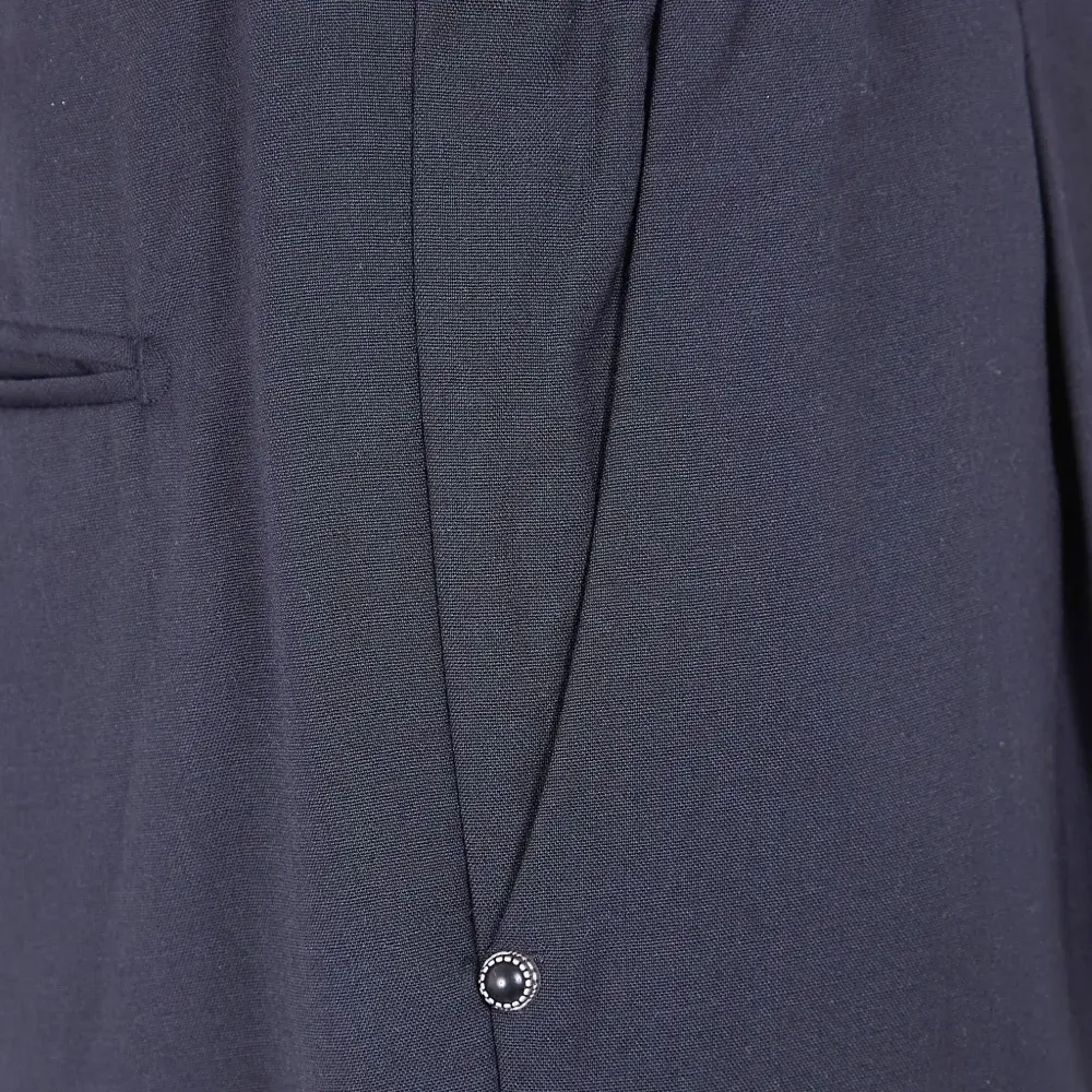 Брюки с карманами и защипами