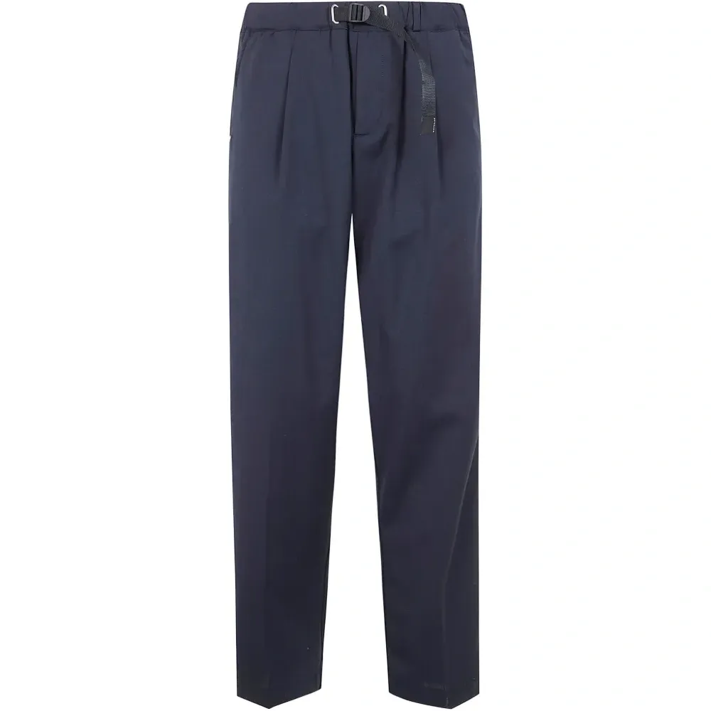 Брюки с карманами и защипами