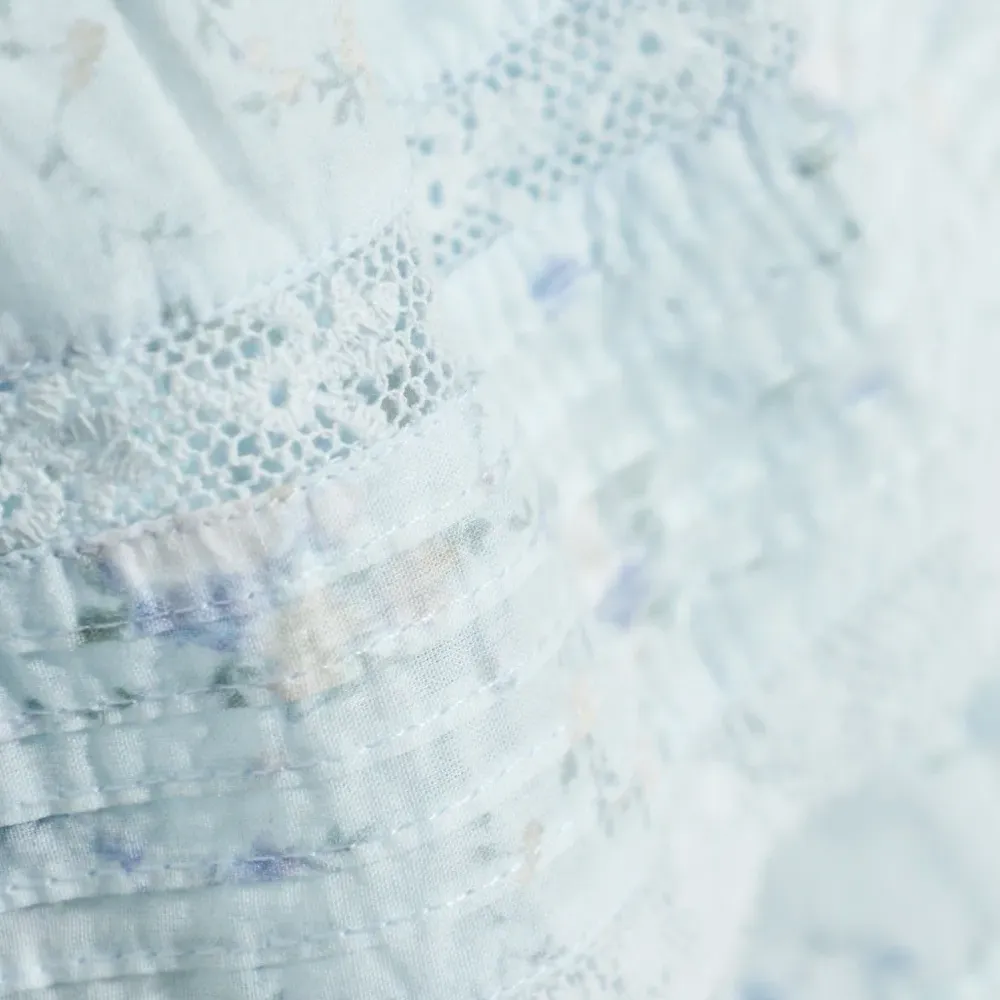 Мини-юбка с рюшами и цветочным принтом