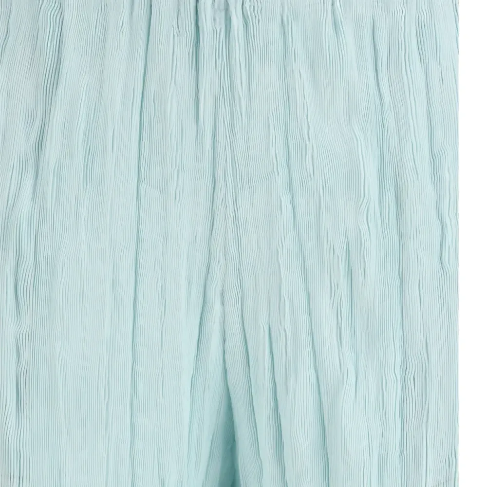 Волнистые брюки с жатым эффектом