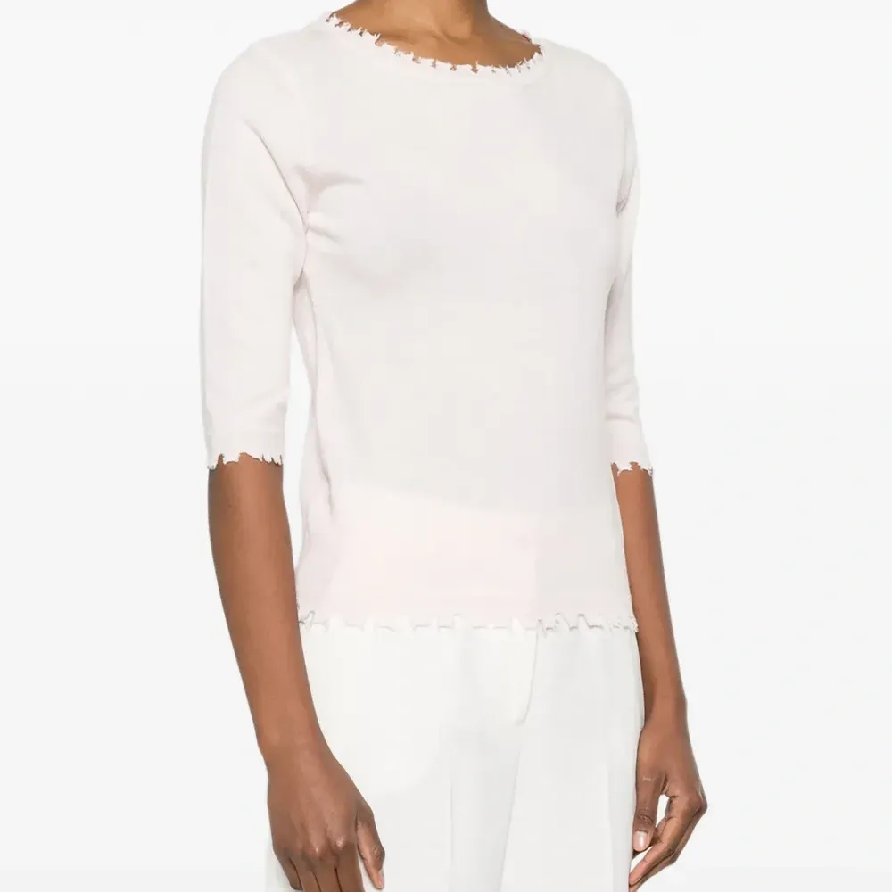 Джемпер с короткими рукавами и волнистым краем