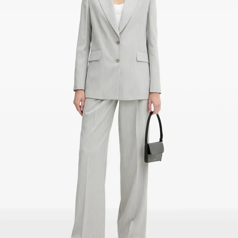 Брюки в полоску с защипами