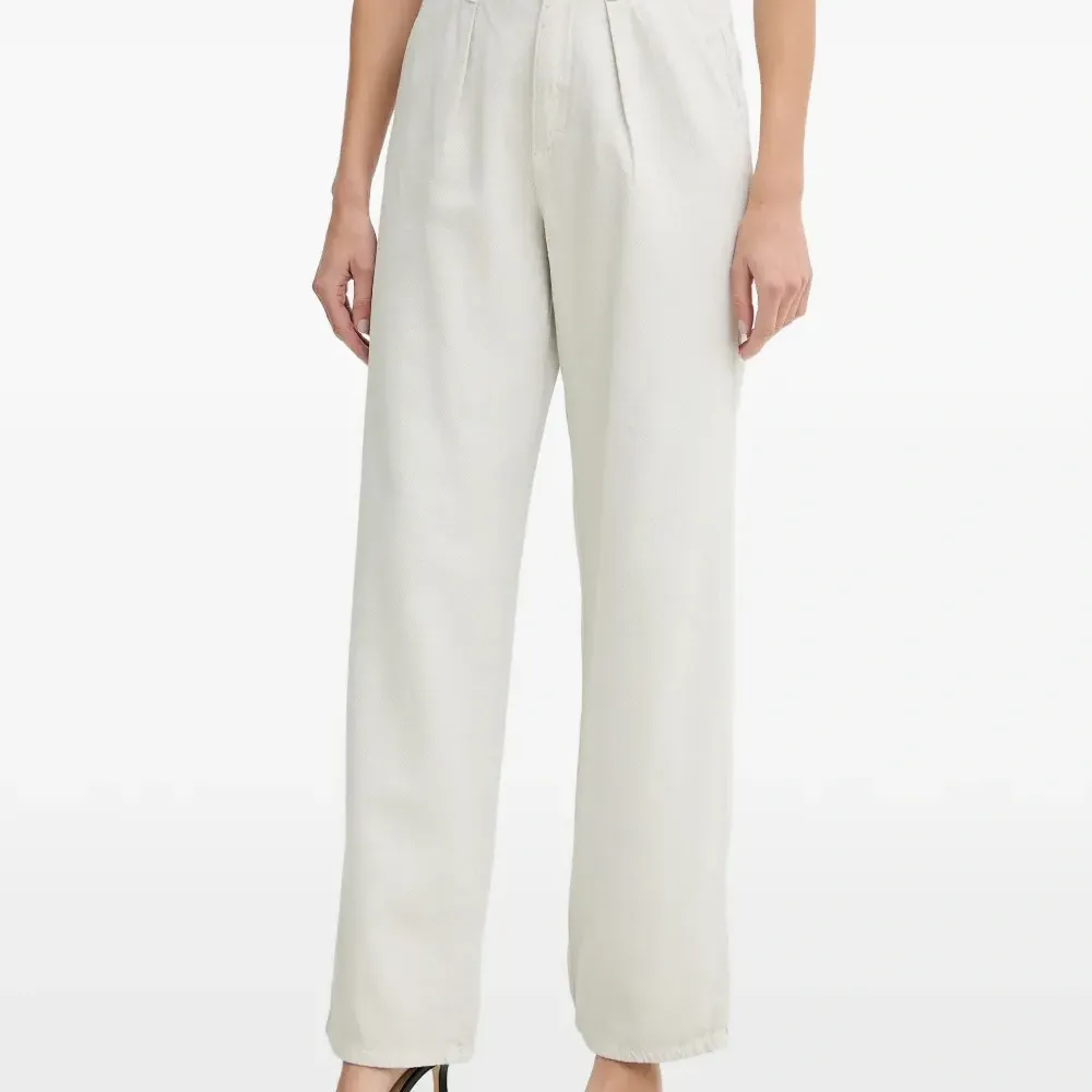 Брюки с декоративными складками