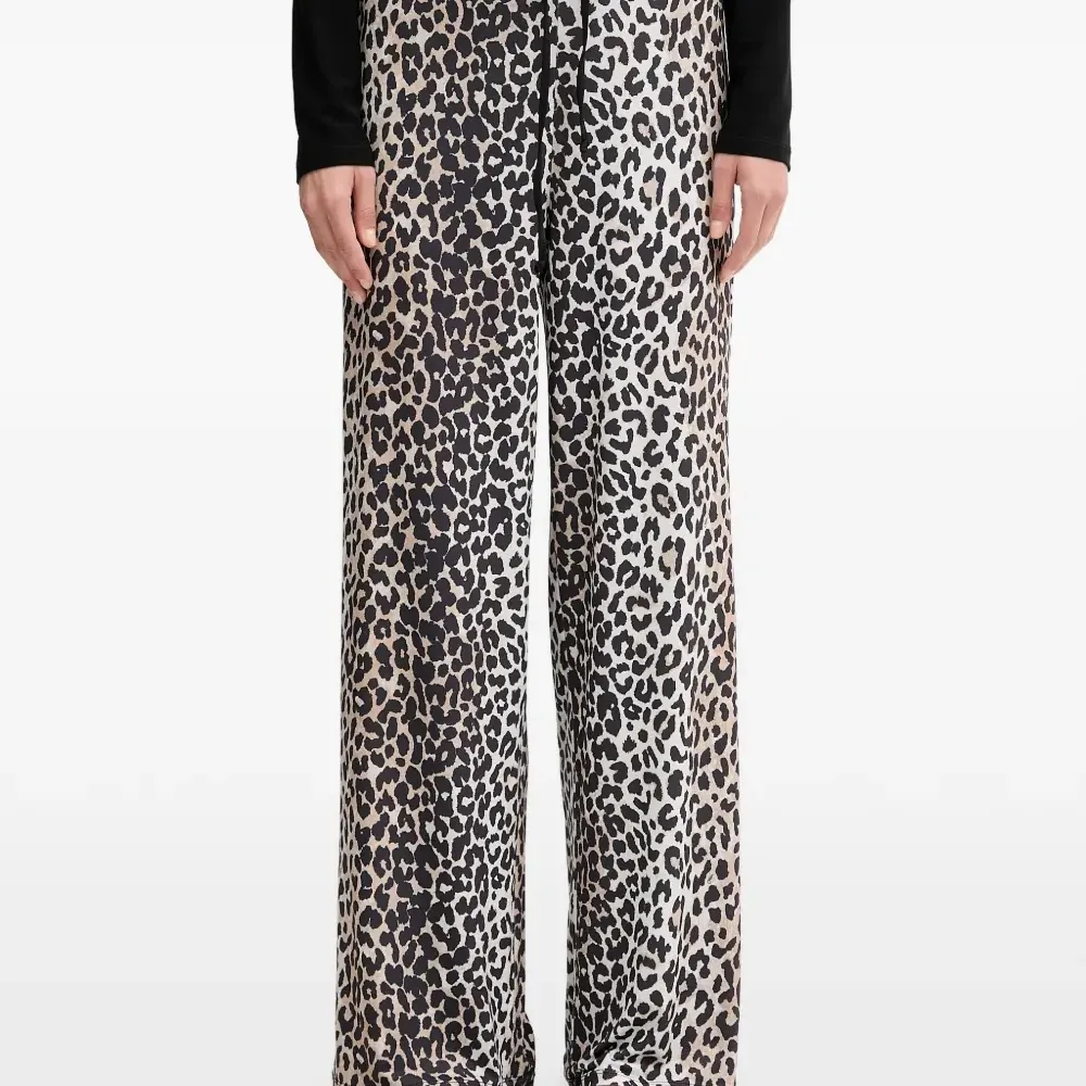 Брюки с завязками и анималистичным принтом