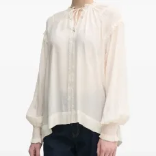 Блузка с длинными рукавами и оборками на манжетах