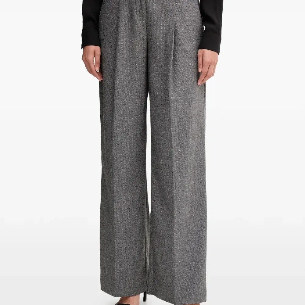 Брюки со складками