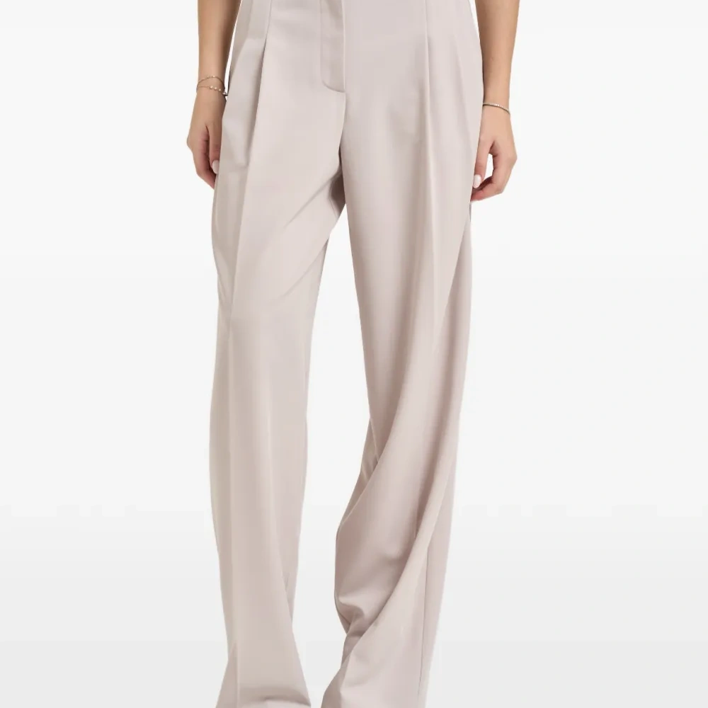 Плиссированные широкие брюки