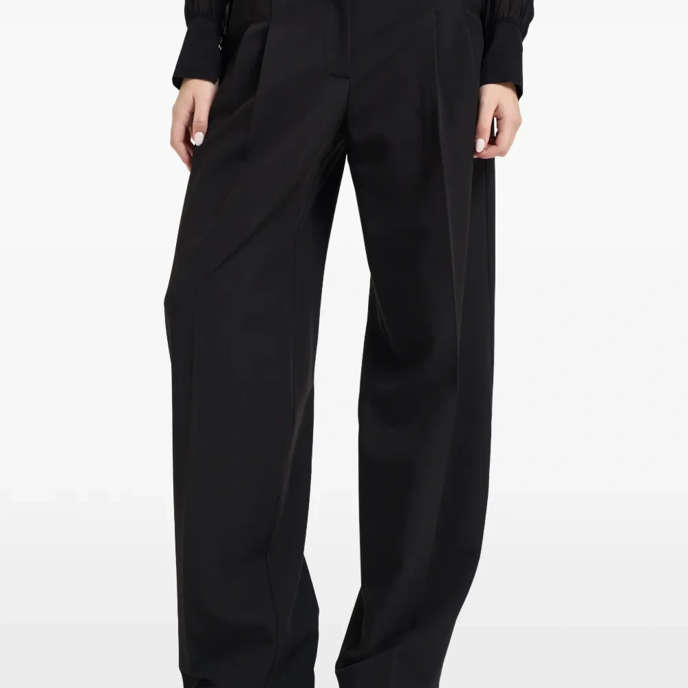 Плиссированные брюки широкого кроя