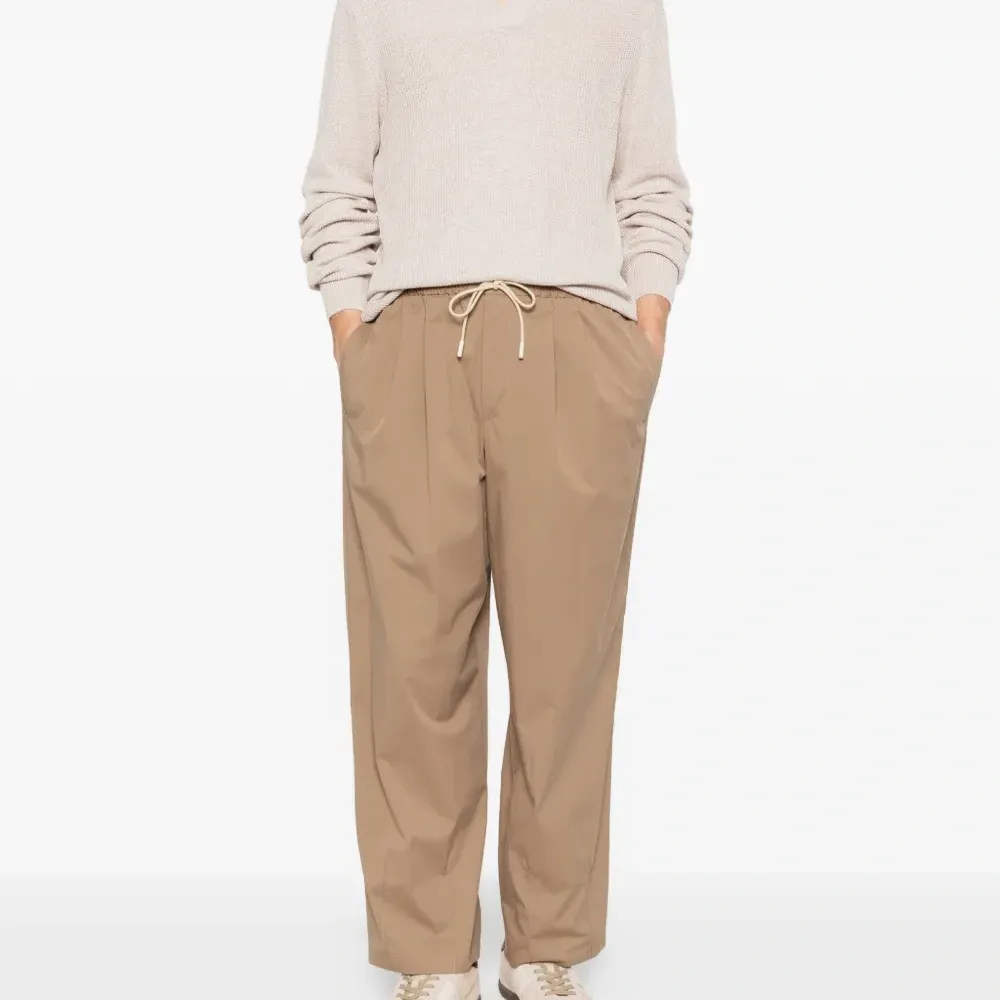 Брюки с защипами