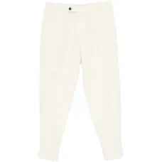 Плиссированные зауженные брюки