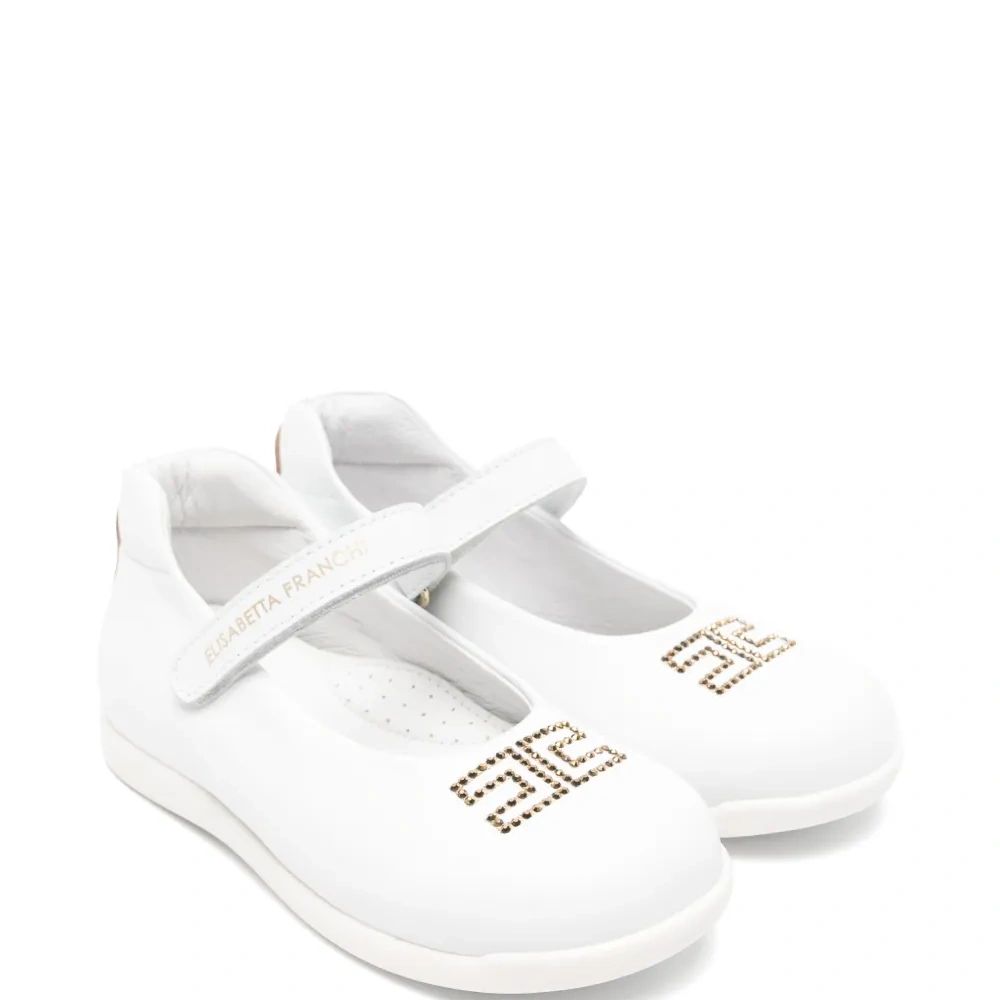 Кожаные балетки с аппликацией и ремешком