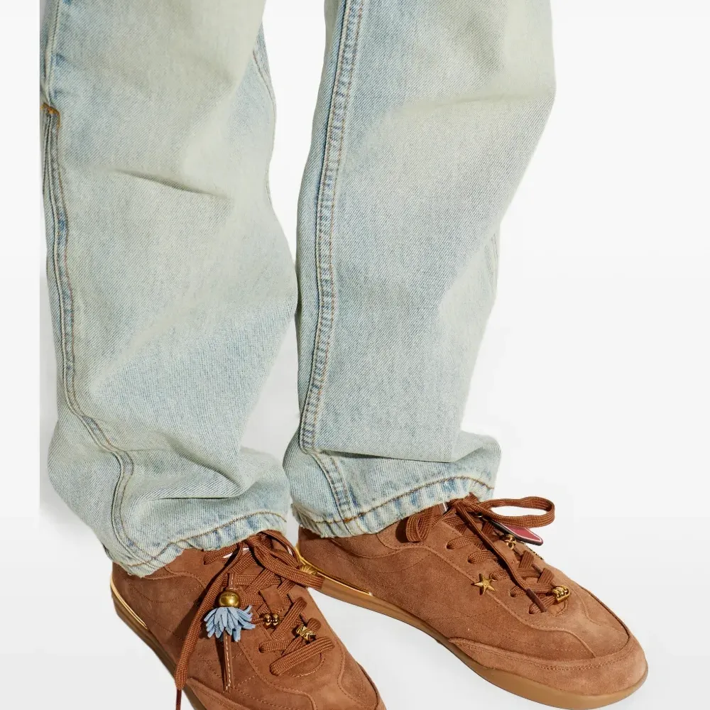 Кроссовки с декоративным элементом